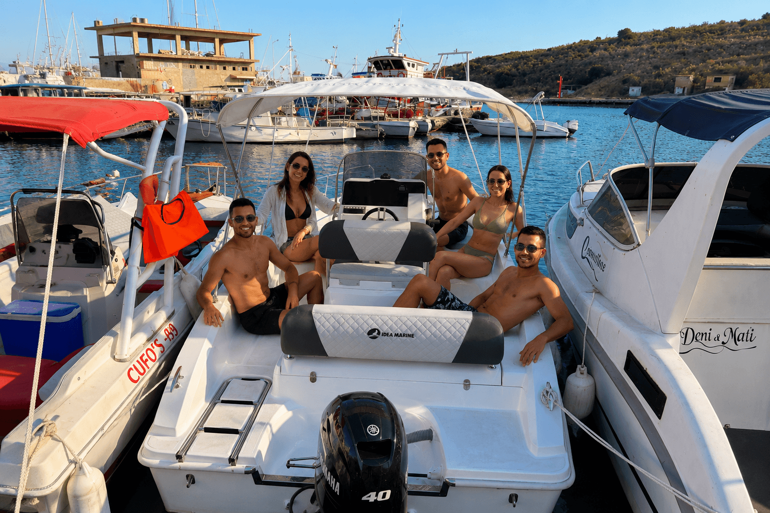 Small motorboat for rent in Sarande with group of friends enjoying a sunny day at sea
