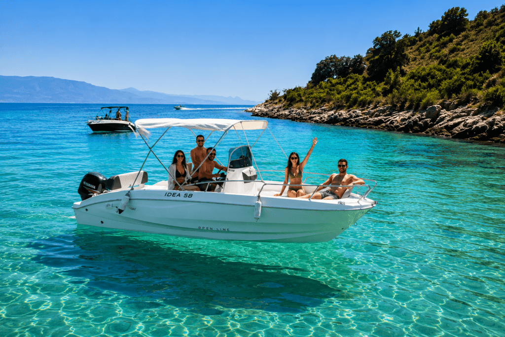 Boat for rent in Sarande Albania cruising through crystal clear turquoise water