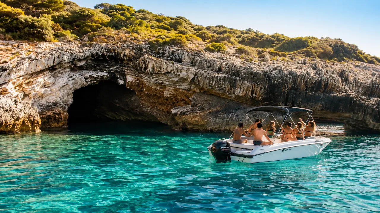 Boat trip Sarande visiting Turtle Cave with a speedboat and crystal-clear water