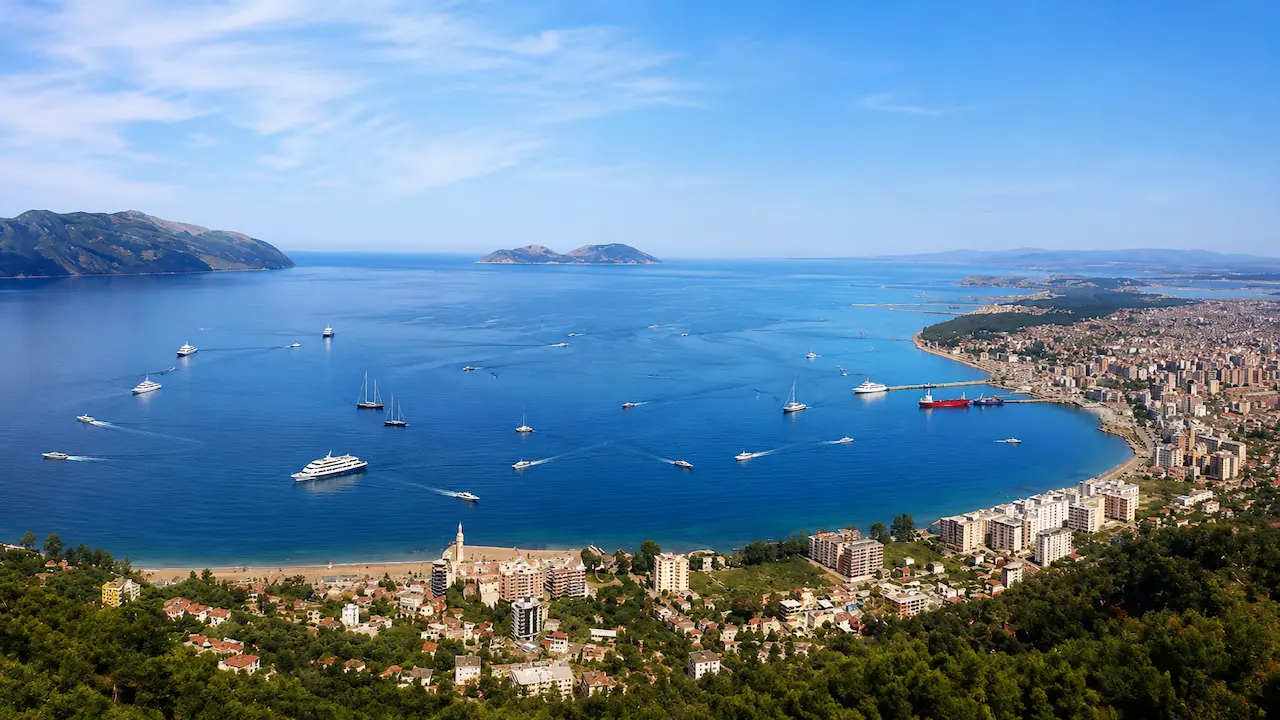 Panoramic view of Vlore Bay with boats and daily boat tours in Albania